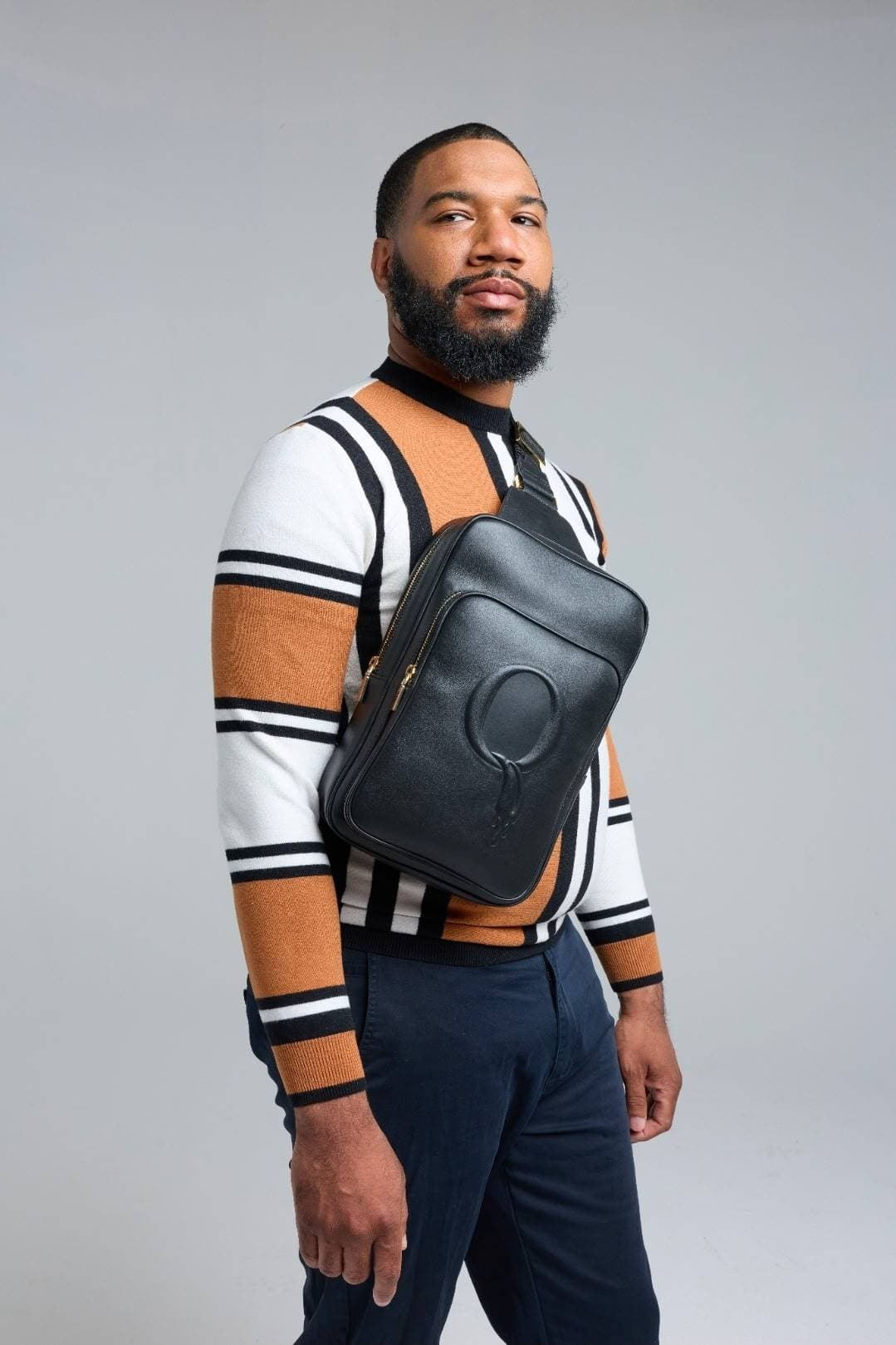 Statement Sling styled with camel stripe sweater