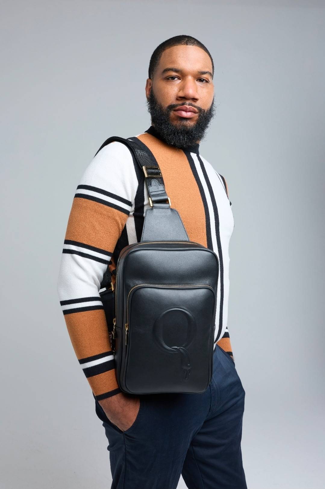 Statement Sling worn crossbody with striped knit