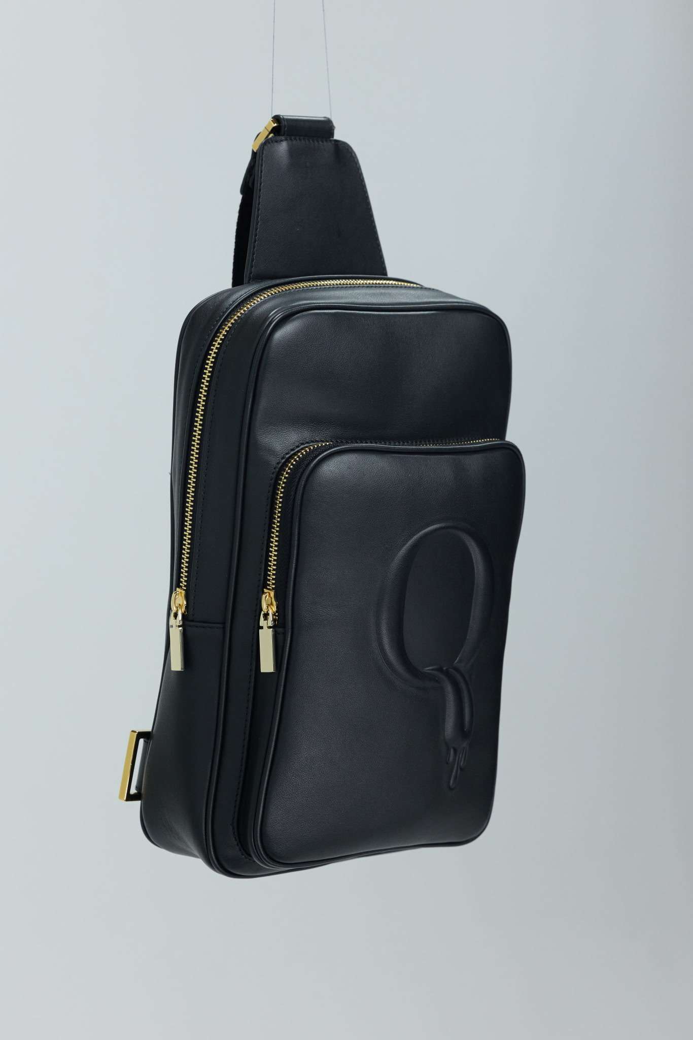QUEER Official Statement Sling — black Italian leather with embossed drip Q