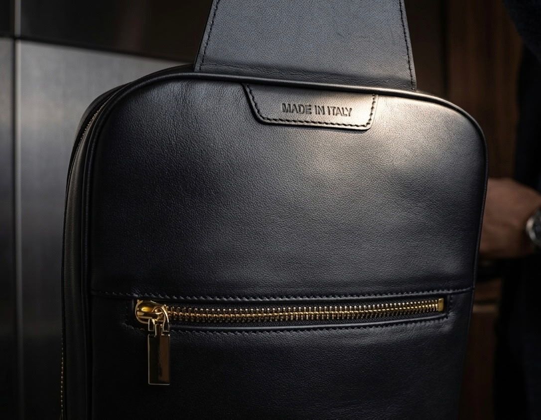 Made in Italy leather tab and gold zipper detail