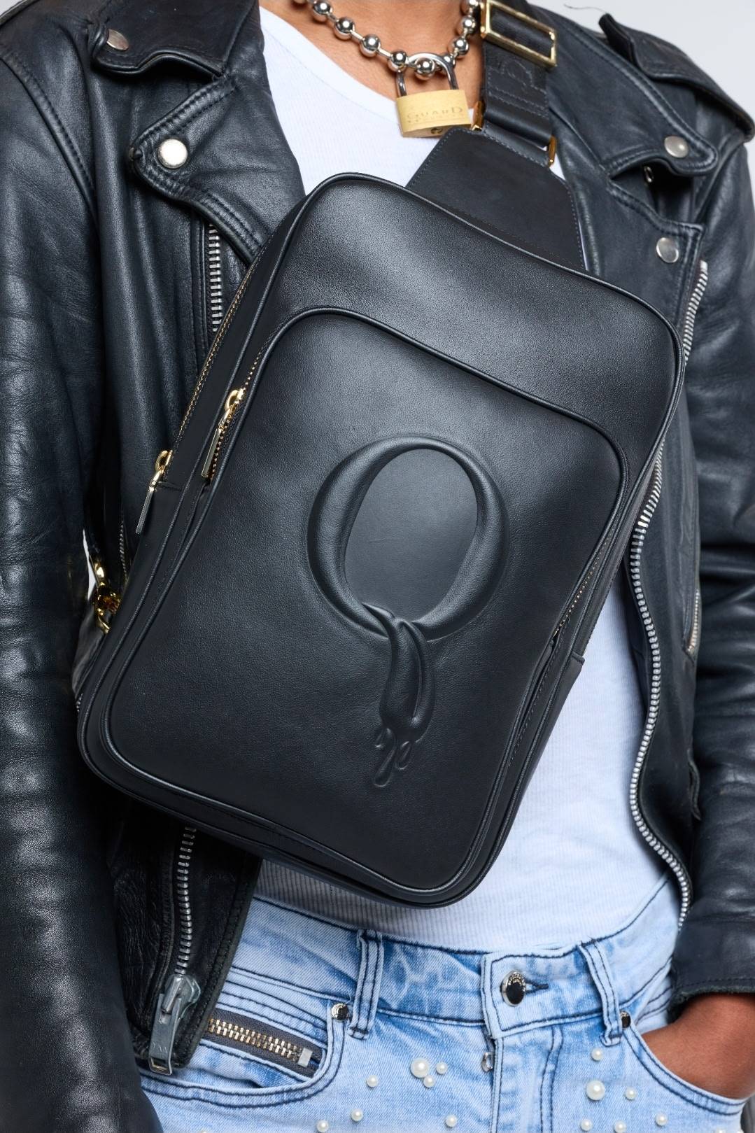 Statement Sling styled with leather jacket and pearl denim